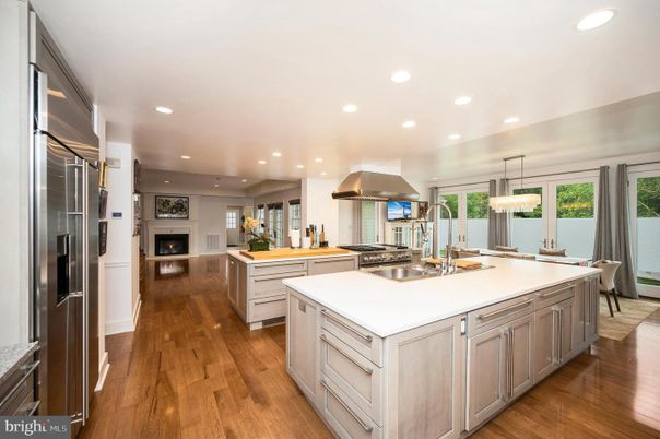 Chandelier, Fireplace, Interior, Kitchen, Pendant Lights, Recessed Lighting, Stainless Steel Appliances, Wood Texture Flooring