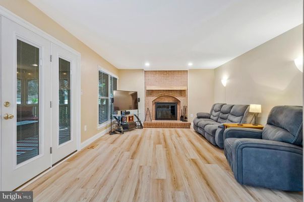 Fireplace, Interior, Living room, Recessed Lighting, Stone Walls, Wood Texture Flooring