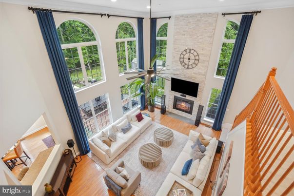 Fireplace, Interior, Living room, Recessed Lighting, Stone Walls, Wood Texture Flooring