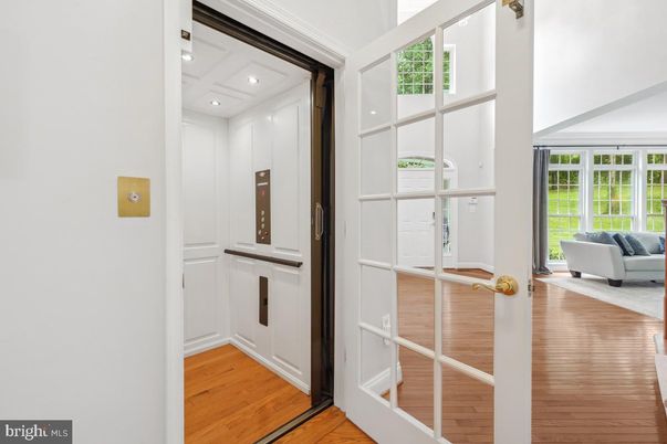 Elevator, Interior, Recessed Lighting, Wood Texture Flooring