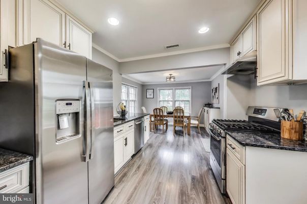 Dining room, Interior, Kitchen, Recessed Lighting, Stainless Steel Appliances, Wood Texture Flooring