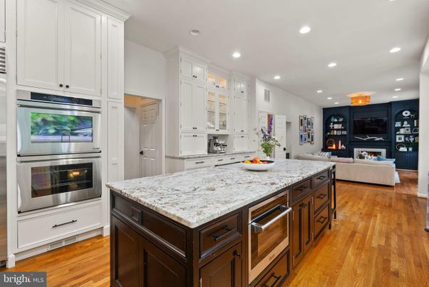 Fireplace, Interior, Kitchen, Living room, Recessed Lighting, Stainless Steel Appliances, Wood Texture Flooring
