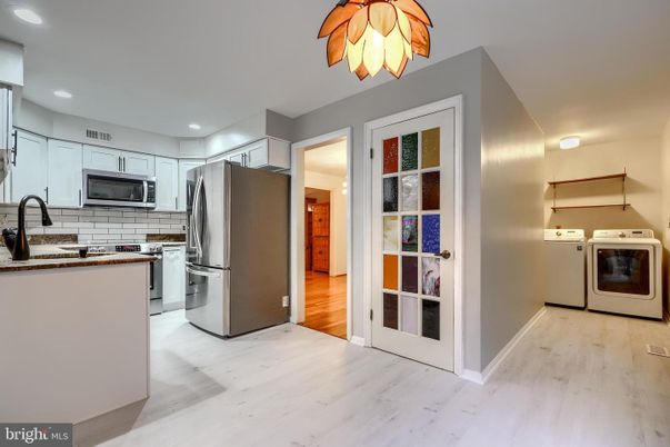 Interior, Kitchen, Recessed Lighting, Stainless Steel Appliances, Washer, Wood Texture Flooring