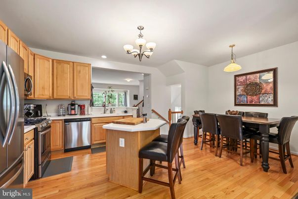 Chandelier, Dining room, Interior, Kitchen, Recessed Lighting, Stainless Steel Appliances, Wood Texture Flooring