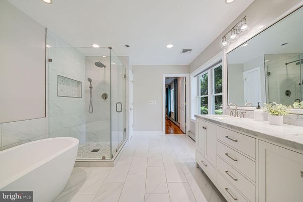 Bathroom, Dual Sink Vanities, Free Standing Baths, Glass Shower, Interior, Marble, Marble Walls, Recessed Lighting, Wood Texture Flooring