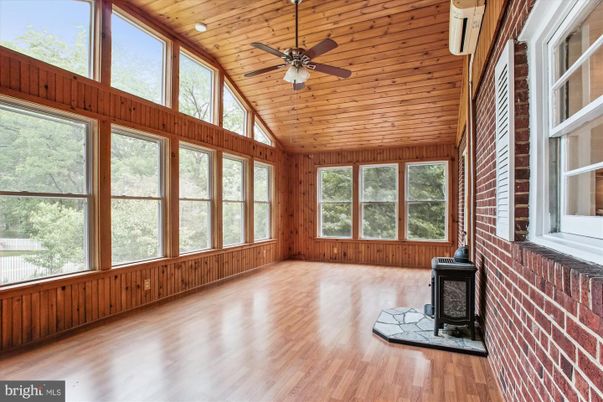 Empty room, Fireplace, Interior, Stone Walls, Sun Room, Wooden Ceilings, Wood Texture Flooring, Wooden Walls