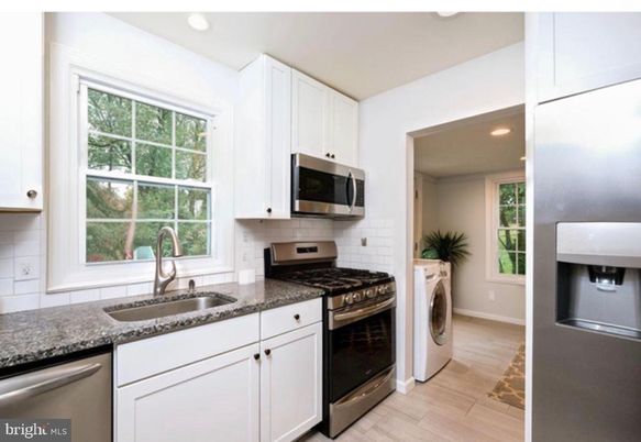 Interior, Kitchen, Recessed Lighting, Stainless Steel Appliances, Washer, Wood Texture Flooring