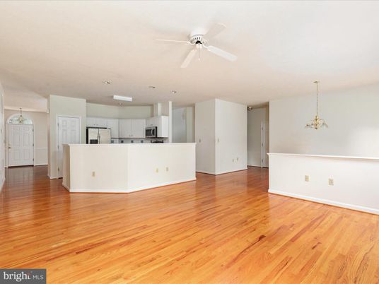 Empty room, Interior, Kitchen, Pendant Lights, Recessed Lighting, Stainless Steel Appliances, Wood Texture Flooring