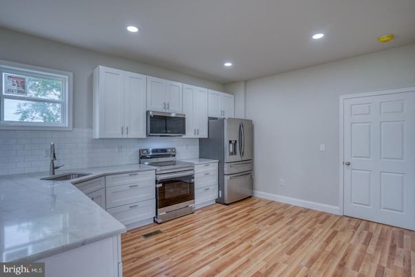 Interior, Kitchen, Recessed Lighting, Stainless Steel Appliances, Wood Texture Flooring