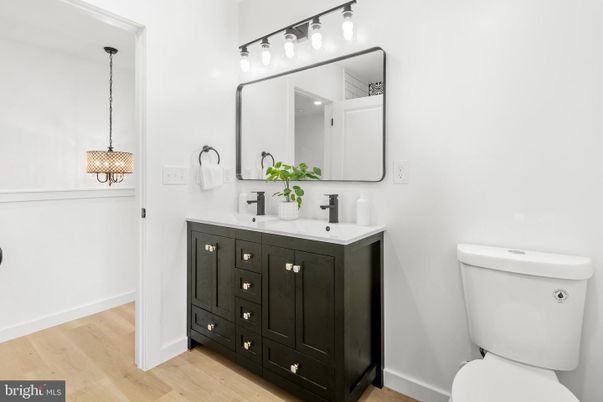 Bathroom, Dual Sink Vanities, Interior, Pendant Lights, Wood Texture Flooring