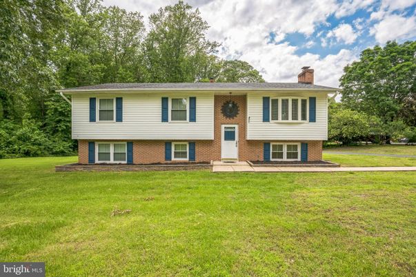 Backyard, Exterior, Facade, Brick Facade, Raised Ranch