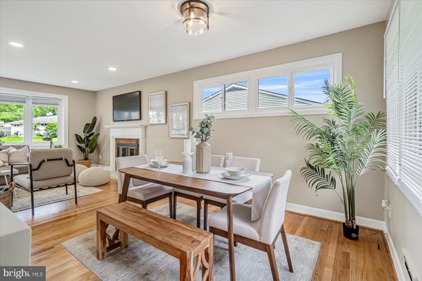 Dining room, Fireplace, Interior, Living room, Recessed Lighting, Wood Texture Flooring
