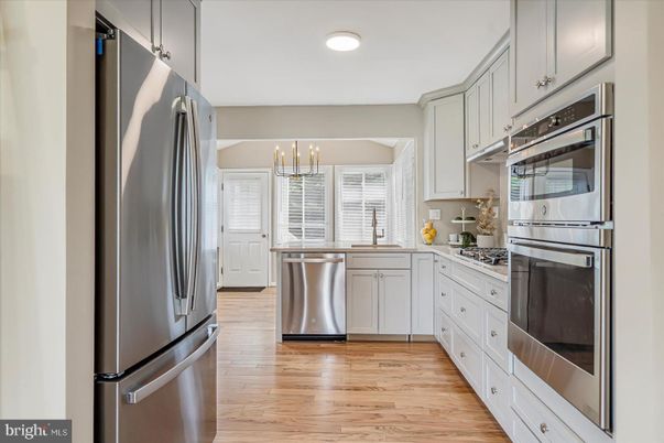 Chandelier, Interior, Kitchen, Recessed Lighting, Stainless Steel Appliances, Wood Texture Flooring