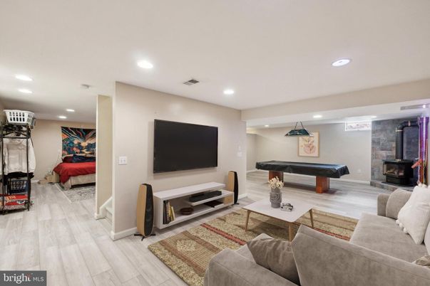Billiard Table, Fireplace, Game Room, Interior, Living room, Recessed Lighting, Wood Texture Flooring