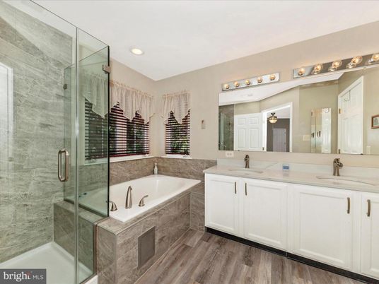 Bathroom, Dual Sink Vanities, Glass Shower, Interior, Recessed Lighting, Wood Texture Flooring