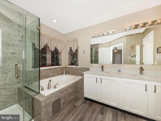 Bathroom, Dual Sink Vanities, Glass Shower, Interior, Recessed Lighting, Wood Texture Flooring
