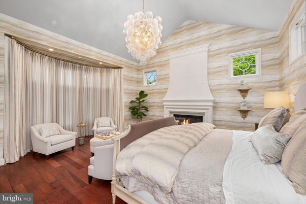 Bedroom, Chandelier, Fireplace, Interior, Recessed Lighting, Wood Texture Flooring