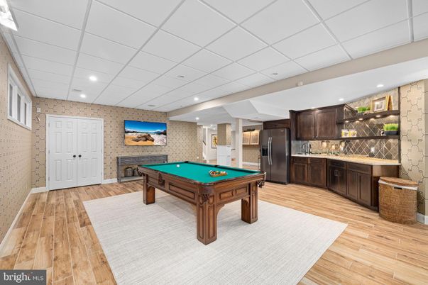 Billiard Table, Fireplace, Game Room, Interior, Kitchen, Recessed Lighting, Stone Walls, Wood Texture Flooring