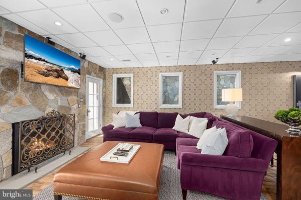 Fireplace, Interior, Living room, Recessed Lighting, Stone Walls, Wood Texture Flooring
