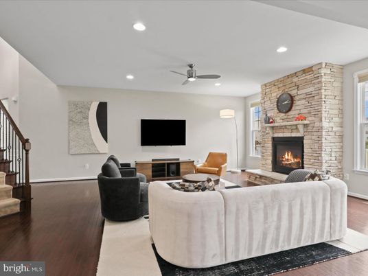 Fireplace, Interior, Living room, Recessed Lighting, Stone Walls, Wood Texture Flooring