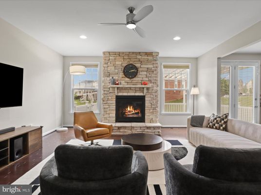 Fireplace, Interior, Living room, Recessed Lighting, Stone Walls, Wood Texture Flooring