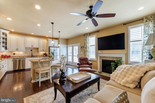 Fireplace, Interior, Kitchen, Living room, Pendant Lights, Recessed Lighting, Stainless Steel Appliances, Wood Texture Flooring