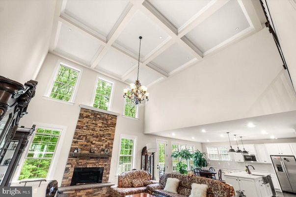 Chandelier, Fireplace, Interior, Kitchen, Pendant Lights, Recessed Lighting, Stainless Steel Appliances, Stone Walls