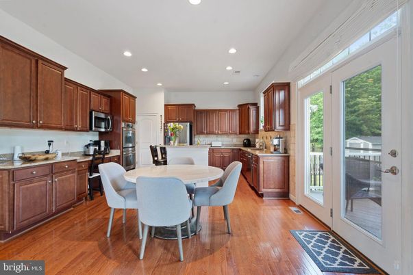 Dining room, Interior, Kitchen, Recessed Lighting, Stainless Steel Appliances, Wood Texture Flooring