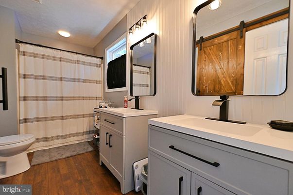 Bathroom, Dual Sink Vanities, Interior, Recessed Lighting, Wood Texture Flooring