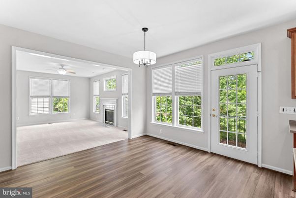 Chandelier, Empty room, Fireplace, Interior, Pendant Lights, Recessed Lighting, Wood Texture Flooring