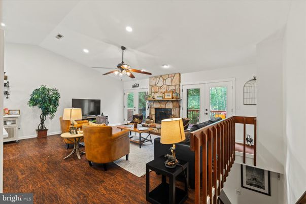 Fireplace, Interior, Living room, Recessed Lighting, Stone Walls, Wood Texture Flooring