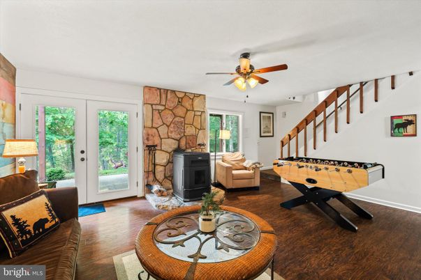 Fireplace, Game Room, Interior, Living room, Stone Walls, Wood Texture Flooring