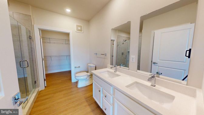 Bathroom, Dual Sink Vanities, Glass Shower, Interior, Recessed Lighting, Walk-in Closets, Wood Texture Flooring