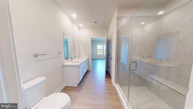 Bathroom, Dual Sink Vanities, Glass Shower, Interior, Recessed Lighting, Wood Texture Flooring