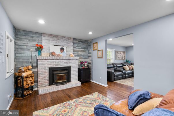 Fireplace, Interior, Living room, Recessed Lighting, Stone Walls, Wood Texture Flooring