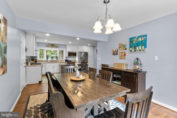 Chandelier, Dining room, Interior, Kitchen, Recessed Lighting, Stainless Steel Appliances, Wood Texture Flooring