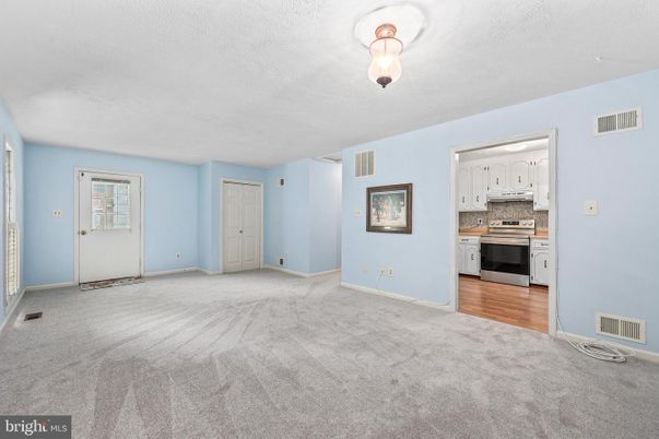Empty room, Interior, Kitchen, Stainless Steel Appliances, Wood Texture Flooring