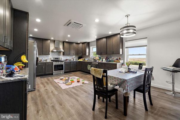 Dining room, Interior, Kitchen, Pendant Lights, Recessed Lighting, Stainless Steel Appliances, Wood Texture Flooring