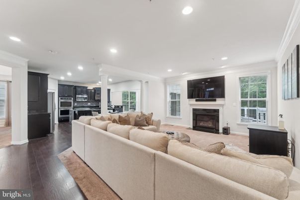 Fireplace, Interior, Kitchen, Living room, Recessed Lighting, Stainless Steel Appliances, Wood Texture Flooring
