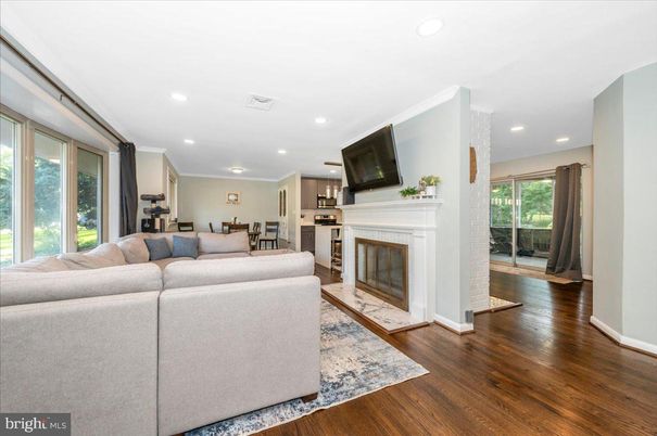 Dining room, Fireplace, Interior, Kitchen, Living room, Recessed Lighting, Stainless Steel Appliances, Wood Texture Flooring