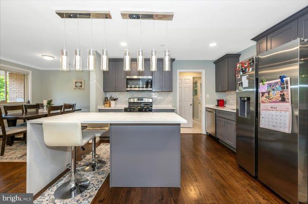 Dining room, Interior, Kitchen, Pendant Lights, Recessed Lighting, Stainless Steel Appliances, Wood Texture Flooring