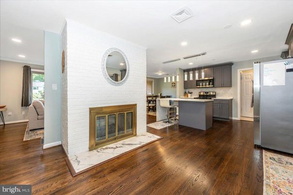 Dining room, Fireplace, Interior, Kitchen, Pendant Lights, Recessed Lighting, Stainless Steel Appliances, Wood Texture Flooring