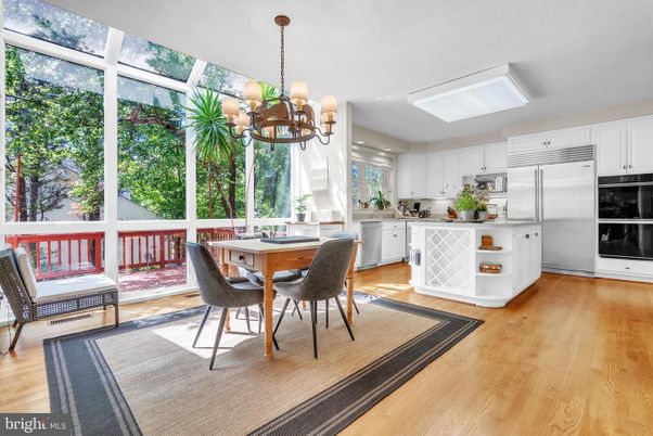 Chandelier, Dining room, Interior, Kitchen, Stainless Steel Appliances, Wood Texture Flooring