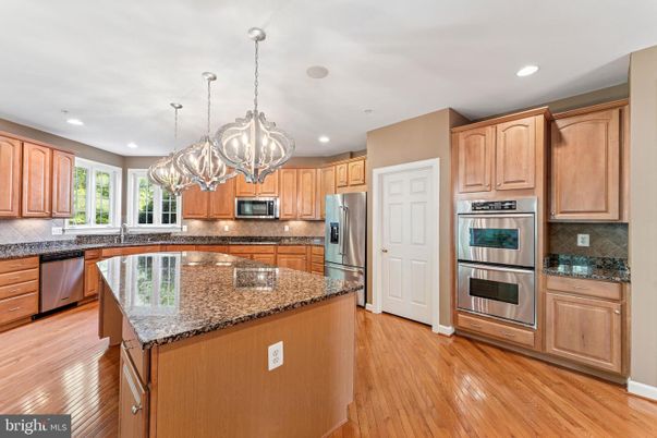 Chandelier, Interior, Kitchen, Pendant Lights, Recessed Lighting, Stainless Steel Appliances, Wood Texture Flooring