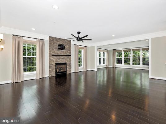 Empty room, Fireplace, Interior, Recessed Lighting, Stone Walls, Wood Texture Flooring