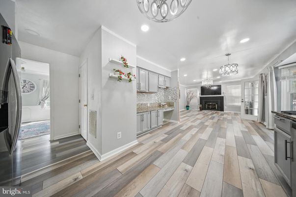 Chandelier, Fireplace, Interior, Kitchen, Recessed Lighting, Wood Texture Flooring