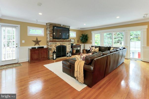 Fireplace, Interior, Living room, Recessed Lighting, Stone Walls, Wood Texture Flooring