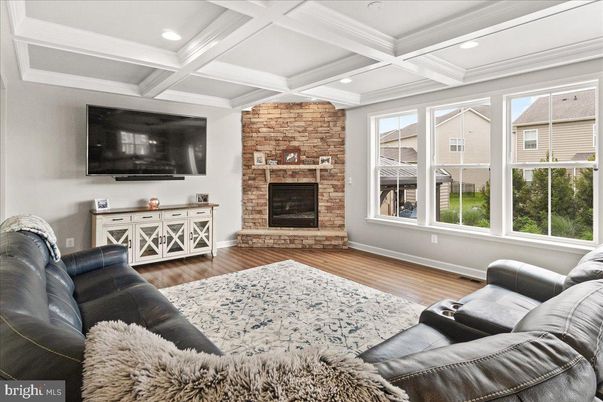 Fireplace, Interior, Living room, Recessed Lighting, Stone Walls, Wood Texture Flooring