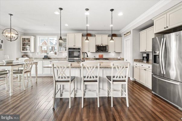 Dining room, Interior, Kitchen, Pendant Lights, Recessed Lighting, Stainless Steel Appliances, Wood Texture Flooring