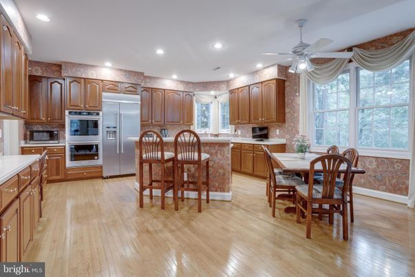 Dining room, Interior, Kitchen, Recessed Lighting, Stainless Steel Appliances, Wood Texture Flooring
